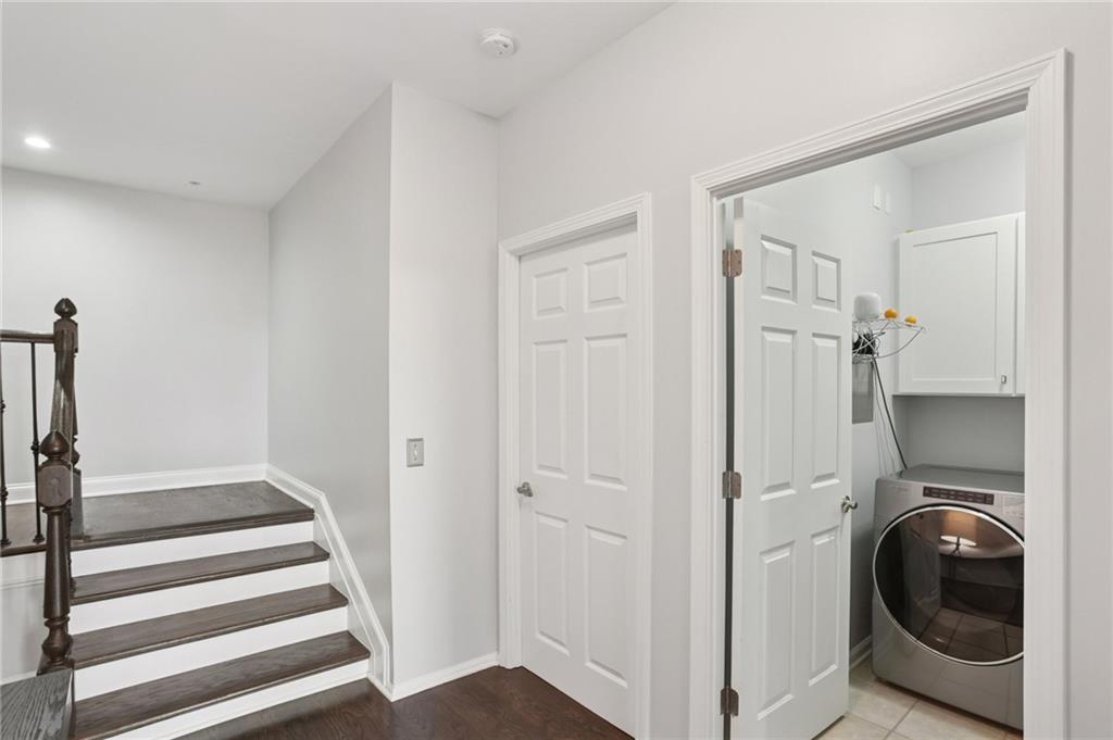 3334 Peachtree Road Northeast, Unit 1908 Atlanta, GA 30326 - Photo 33 of 46 a view of a hallway with washer and dryer