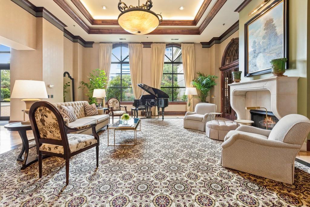 3334 Peachtree Road Northeast, Unit 1908 Atlanta, GA 30326 - Photo 37 of 46 a living room with furniture fireplace and a large window