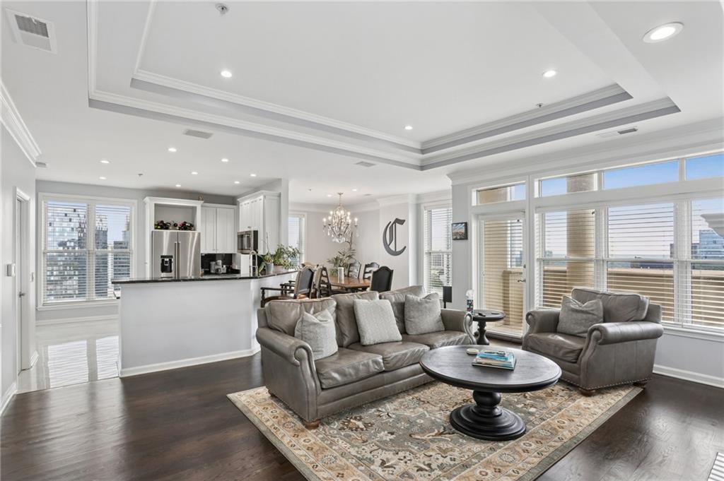 3334 Peachtree Road Northeast, Unit 1908 Atlanta, GA 30326 - Photo 7 of 46 a living room with furniture and a large window