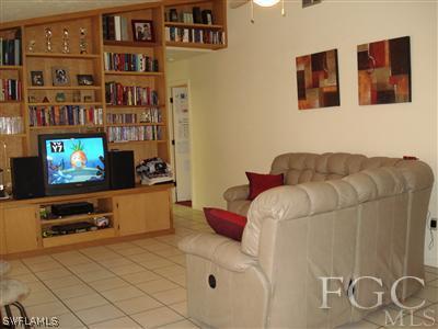 17436 Delaware Road Fort Myers, FL 33967 - Photo 5 of 10 a living room with furniture and a flat screen tv