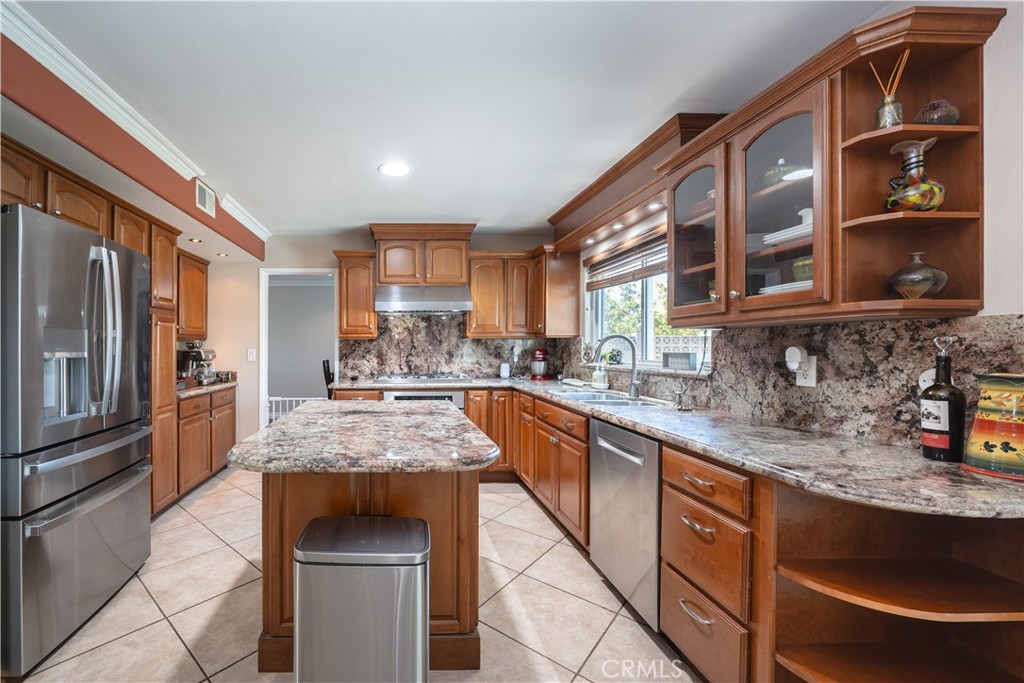 2203 Homewood Avenue Simi Valley, CA 93063 - Photo 6 of 37 a kitchen with stainless steel appliances granite countertop a sink stove and cabinets