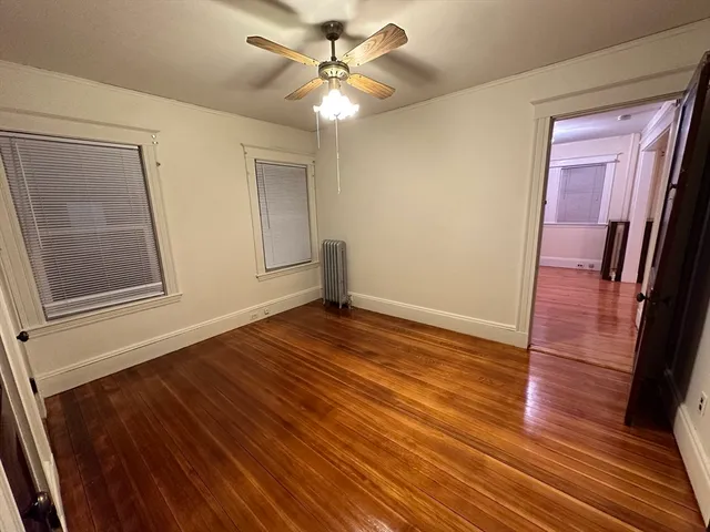 a bathroom with a sink mirror and toilet