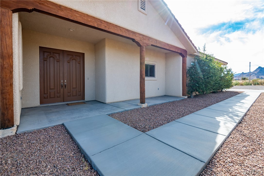 1830 Egar Road Golden Valley, AZ 86413 - Photo 53 of 84 a view of a house with a backyard