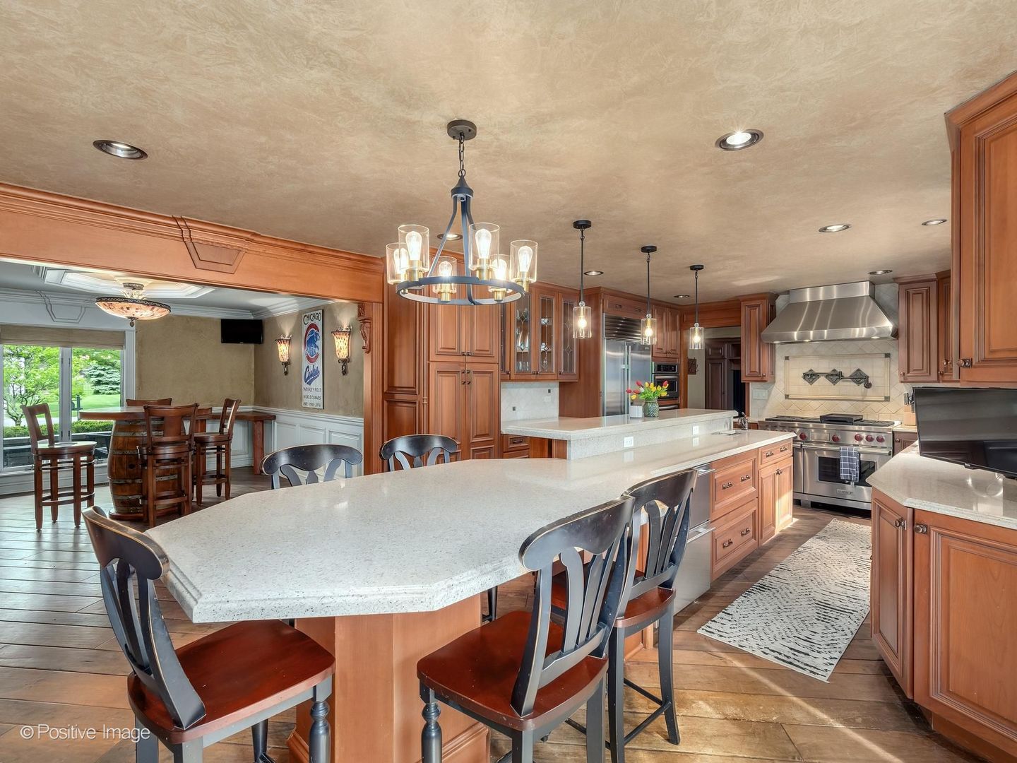 6451 Garfield Ridge Court Burr Ridge, IL 60527 - Photo 6 of 28 a large kitchen with a table and chairs