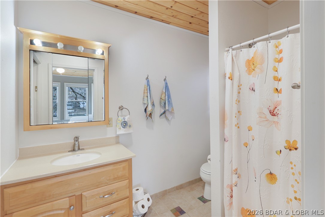 29966 Oak Knoll Road Rocky Mount, MO 65072 - Photo 26 of 68 Primary bedroom bath includes a walk-in shower, up