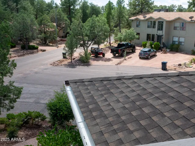 a view of a forest with a house