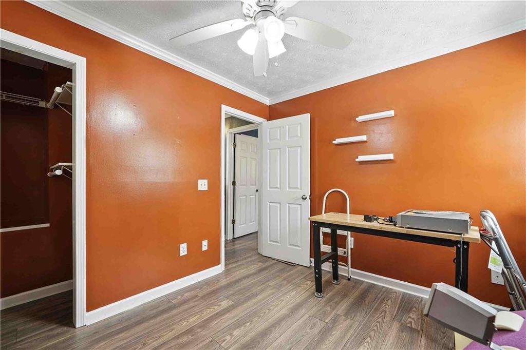 550 Donahoo Road Southeast Silver Creek, GA 30173 - Photo 20 of 29 a view of a workspace with furniture and wooden floor