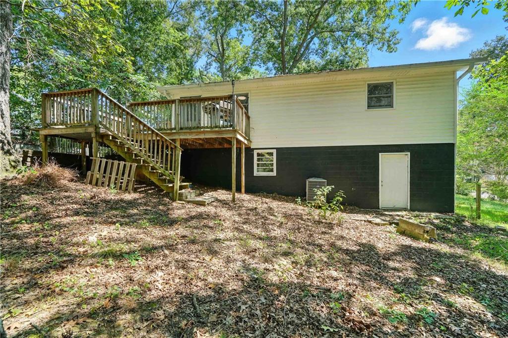 550 Donahoo Road Southeast Silver Creek, GA 30173 - Photo 6 of 29 a backyard of a house with table and chairs