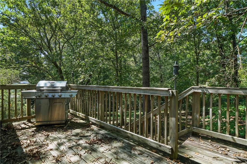 550 Donahoo Road Southeast Silver Creek, GA 30173 - Photo 8 of 29 a view of balcony with wooden floor and outdoor seating