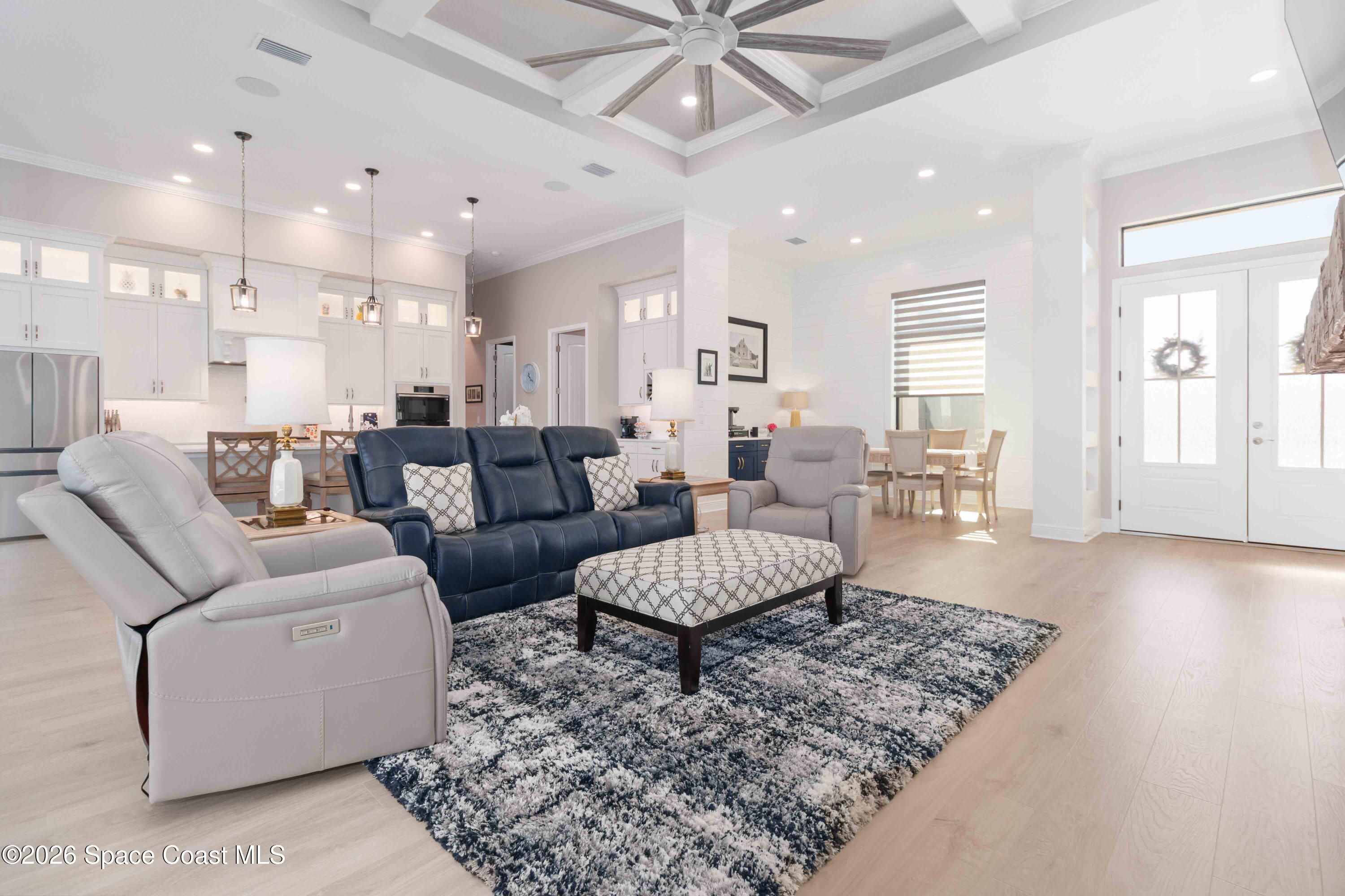 4100 Domain Court Melbourne, FL 32934 - Photo 14 of 52 a living room with furniture and a wooden floor