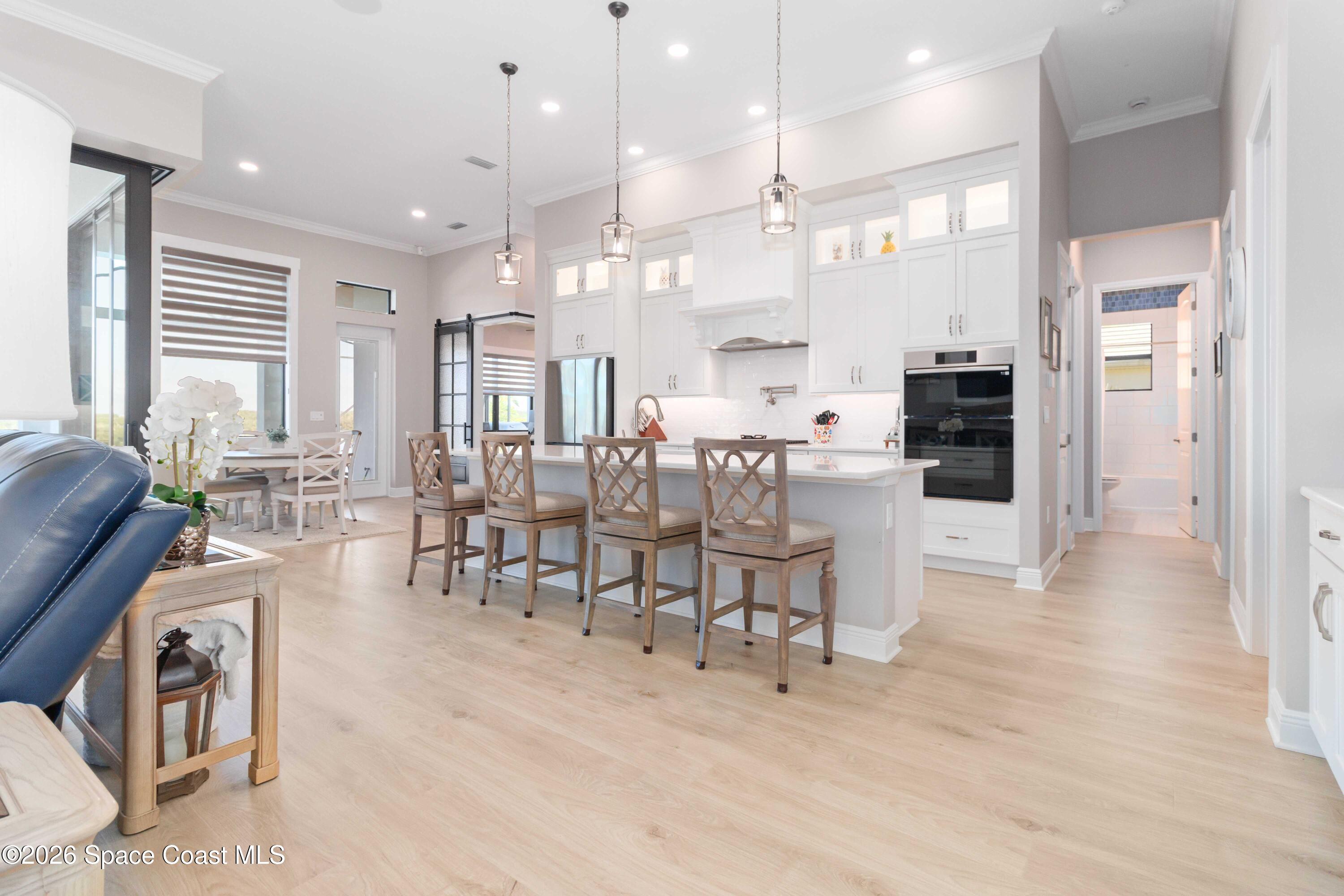 4100 Domain Court Melbourne, FL 32934 - Photo 17 of 52 a large kitchen with a table and chairs