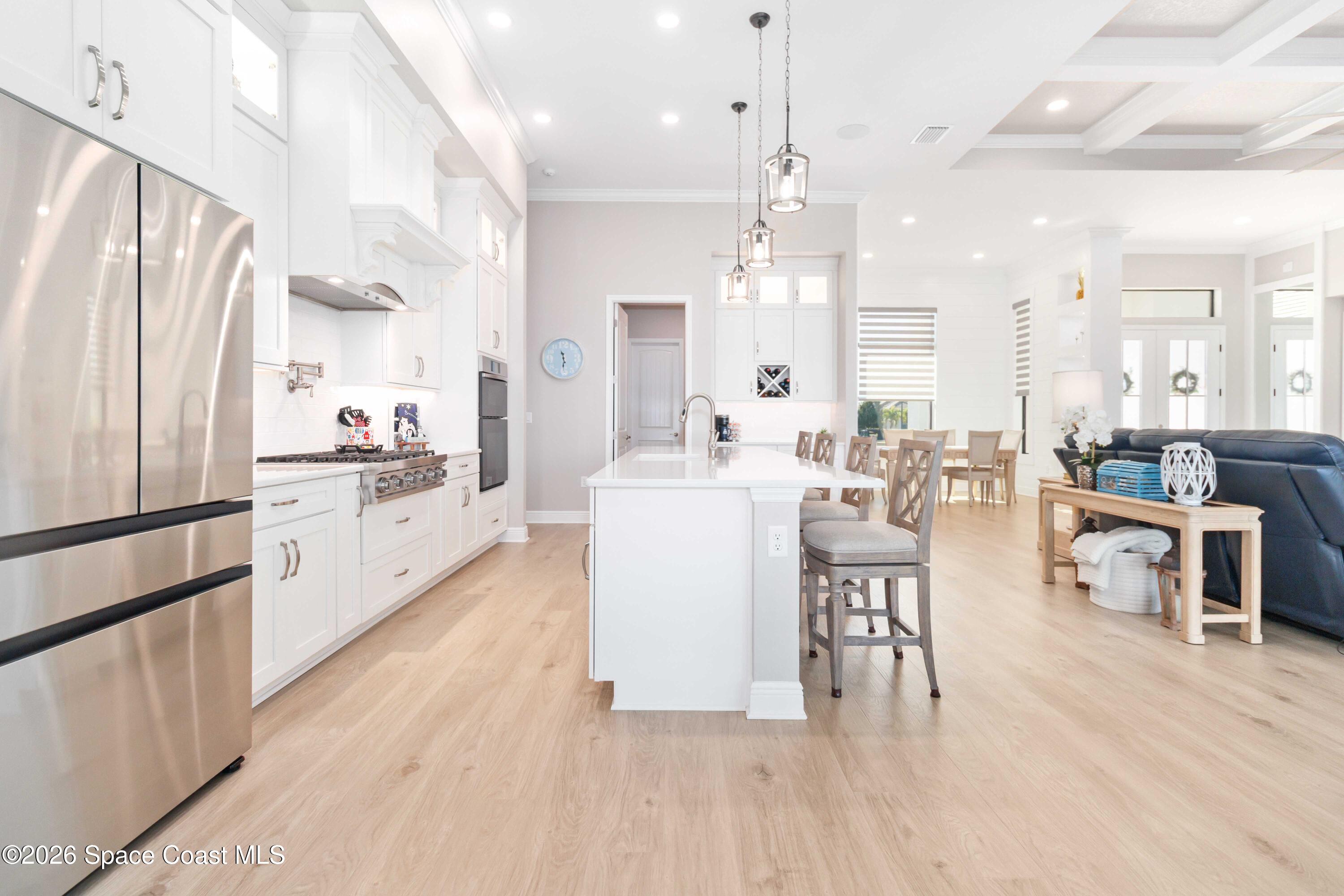 4100 Domain Court Melbourne, FL 32934 - Photo 19 of 52 a large kitchen with a table and chairs