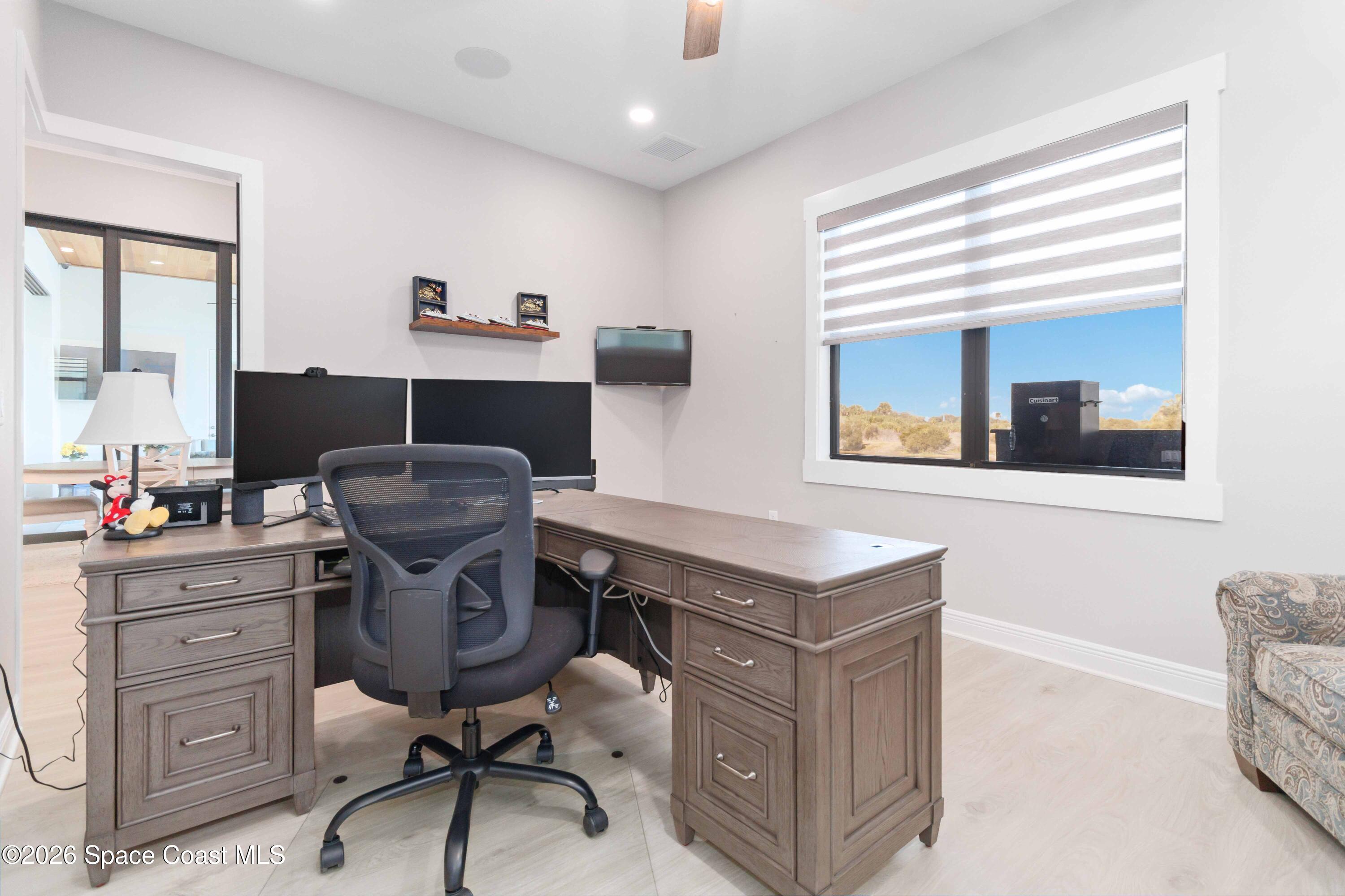 4100 Domain Court Melbourne, FL 32934 - Photo 23 of 52 a view of a workspace with furniture and a window