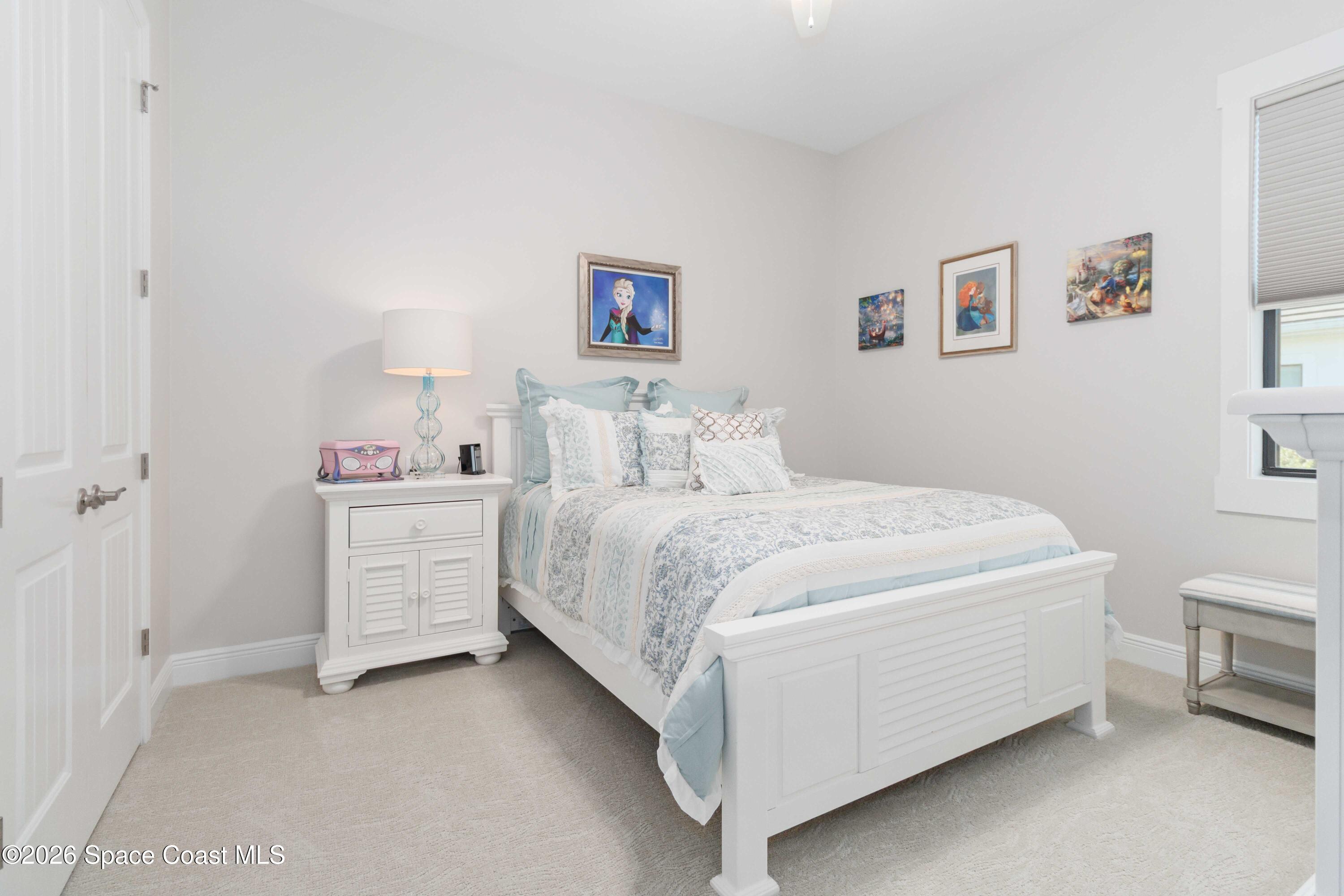 4100 Domain Court Melbourne, FL 32934 - Photo 28 of 52 a room with a bed and a night stand
