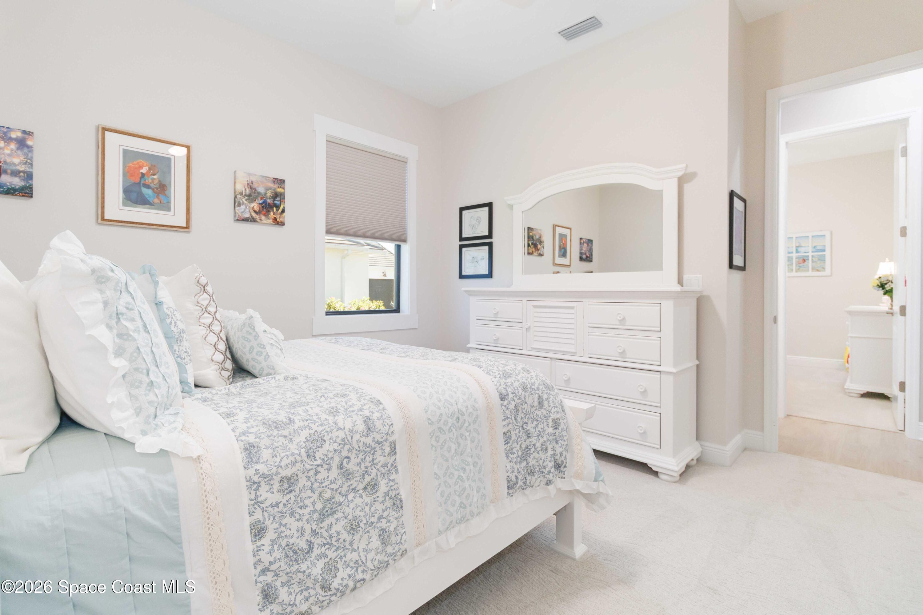 4100 Domain Court Melbourne, FL 32934 - Photo 29 of 52 a bedroom with a bed and a cabinets