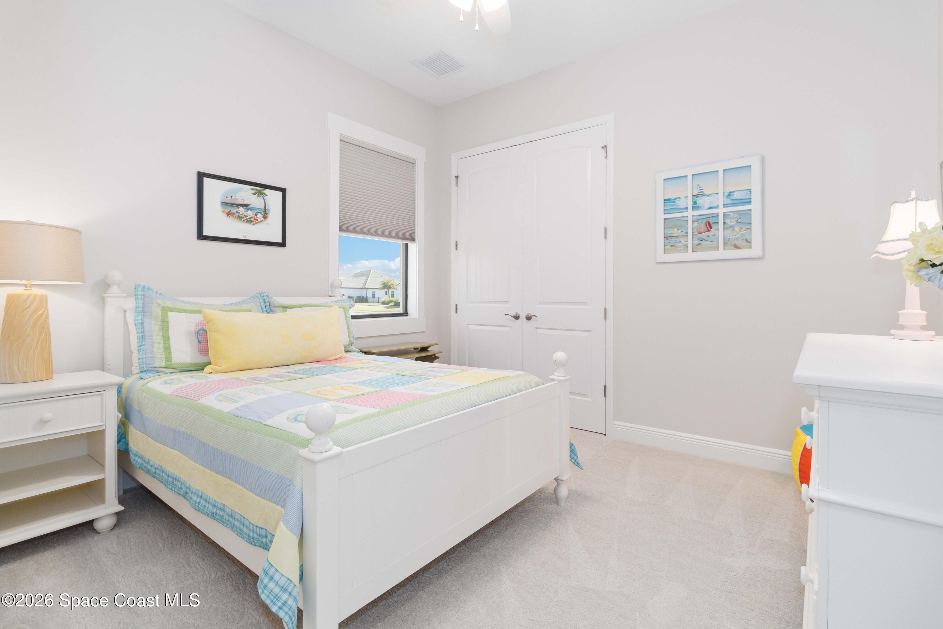 4100 Domain Court Melbourne, FL 32934 - Photo 31 of 52 a bedroom with a bed and a couch