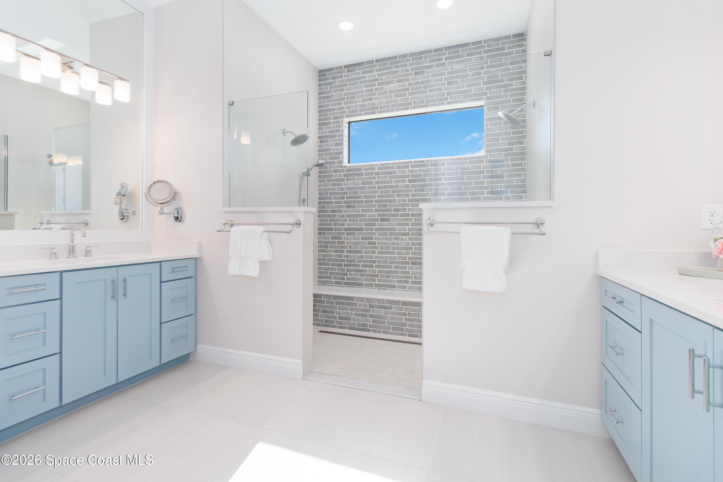 4100 Domain Court Melbourne, FL 32934 - Photo 37 of 52 a bathroom with a sink a vanity and a mirror