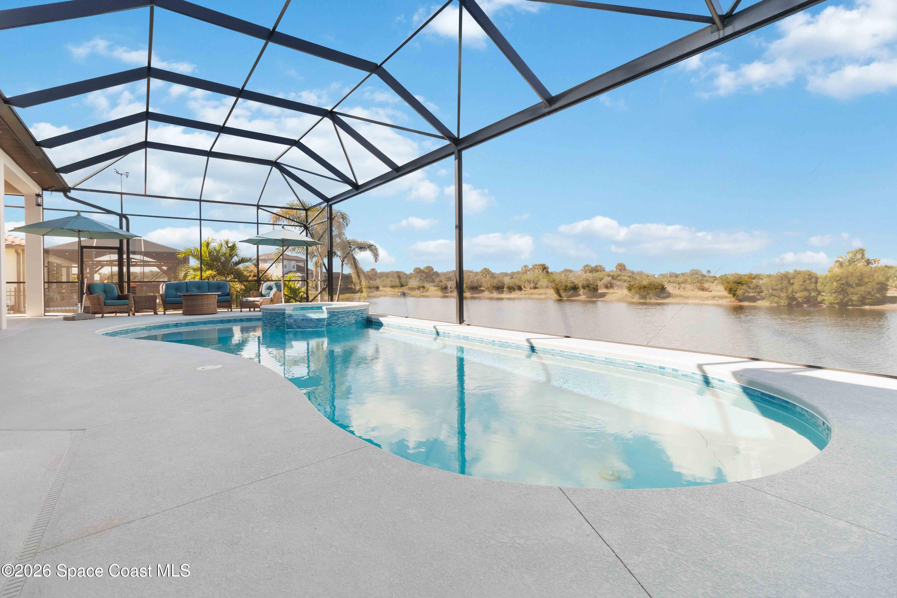 4100 Domain Court Melbourne, FL 32934 - Photo 45 of 52 a view of a swimming pool with a lake view