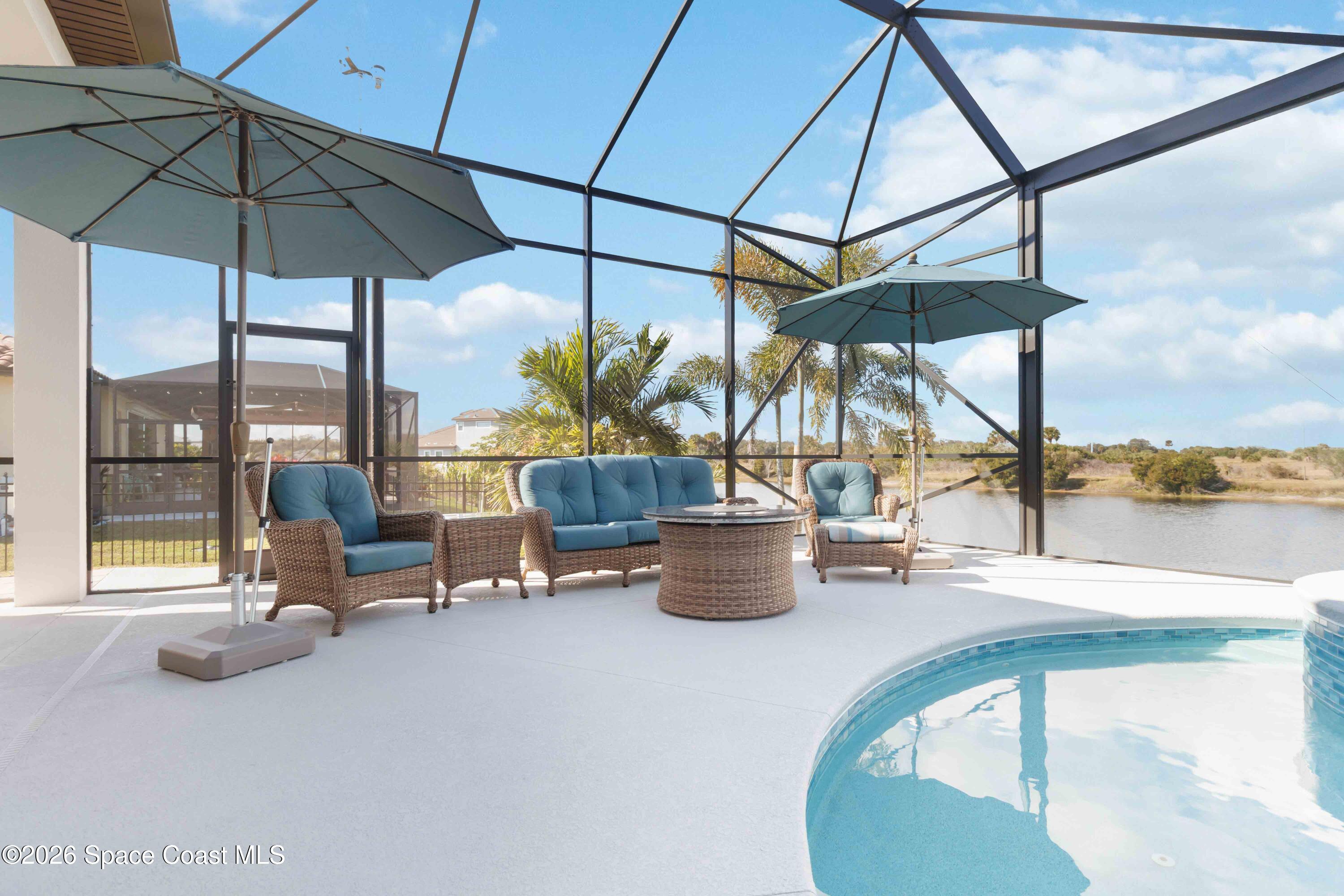 4100 Domain Court Melbourne, FL 32934 - Photo 49 of 52 a view of a swimming pool with a lounge chairs