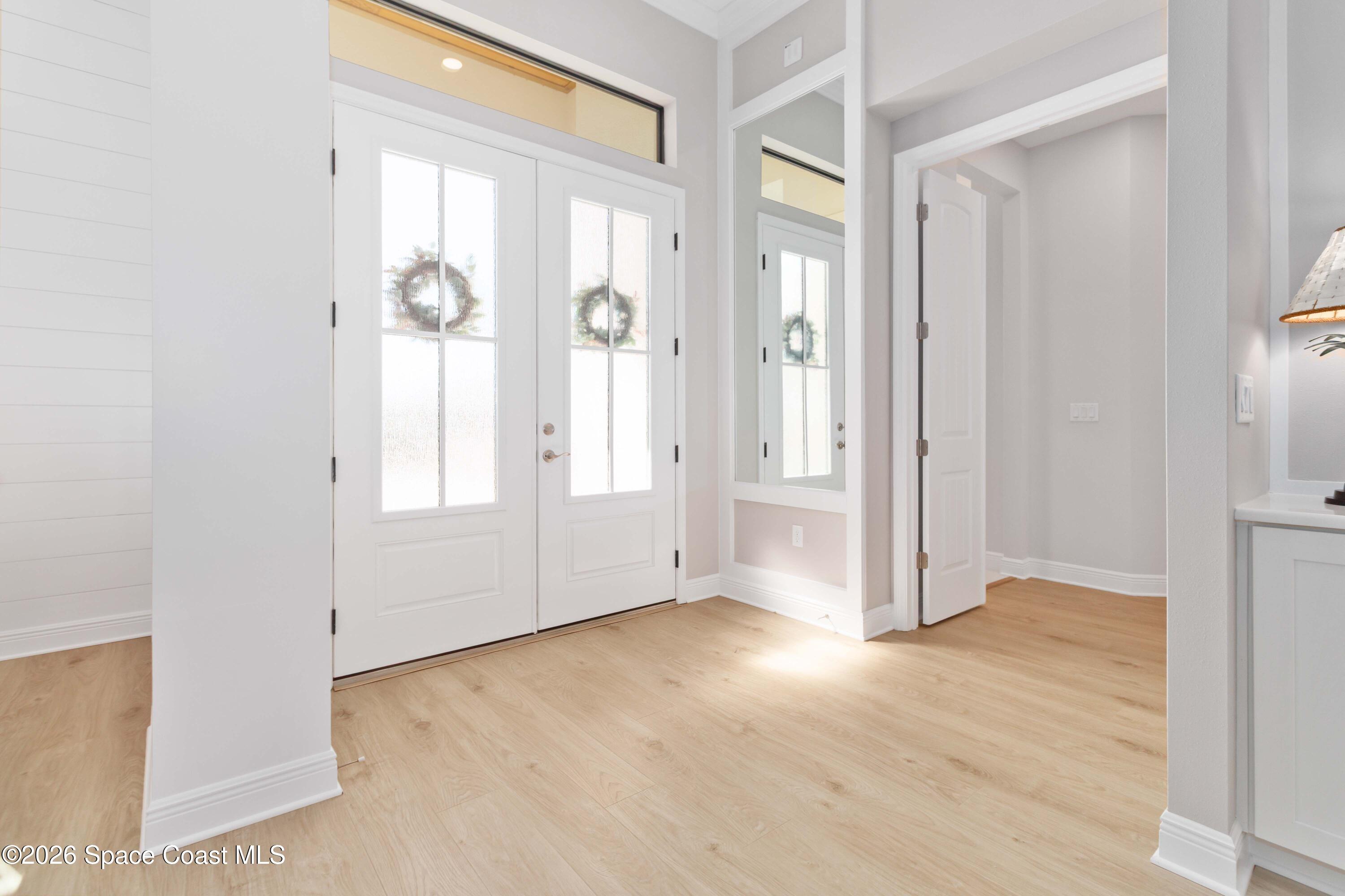4100 Domain Court Melbourne, FL 32934 - Photo 8 of 52 wooden floor in an empty room with a window