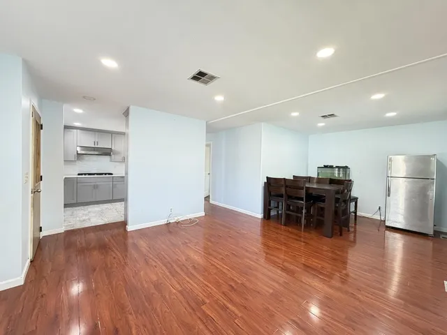 a view of kitchen with furniture and wooden floor