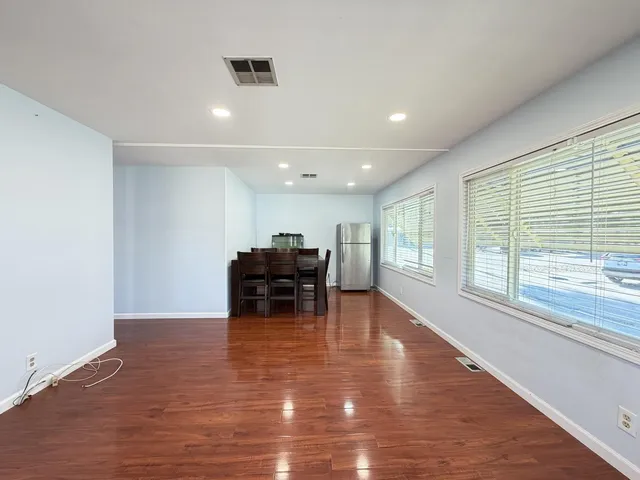 a view of kitchen with microwave and furniture