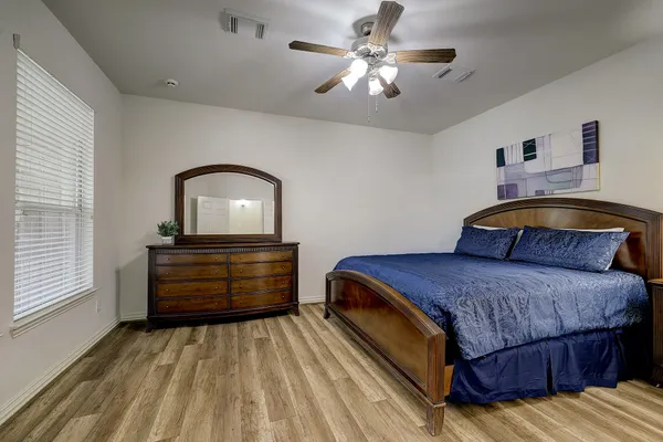 a bedroom with a bed and window