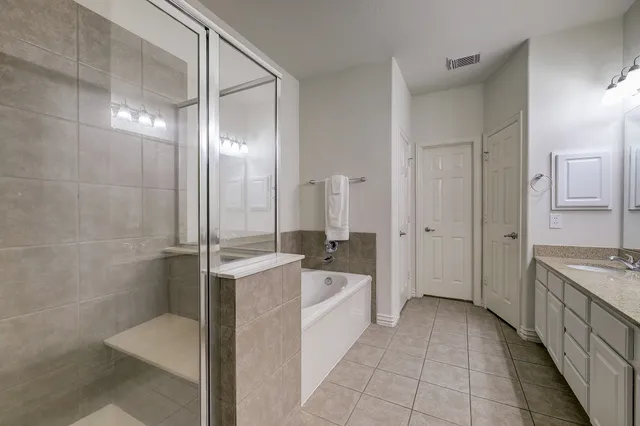 a bathroom with a bathtub and a sink