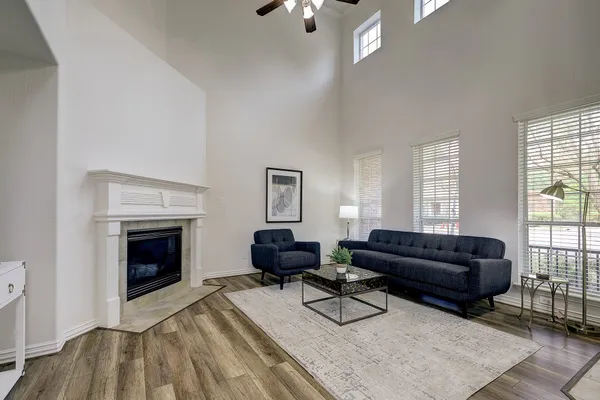 a living room with furniture and a fireplace