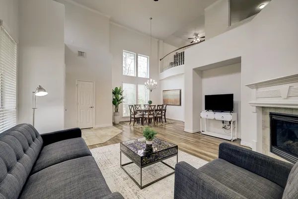 a living room with furniture fireplace and window