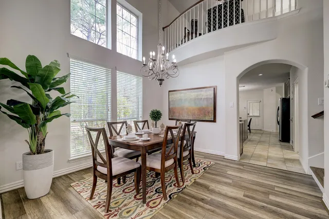 a view of a dining room with furniture window and wooden floor
