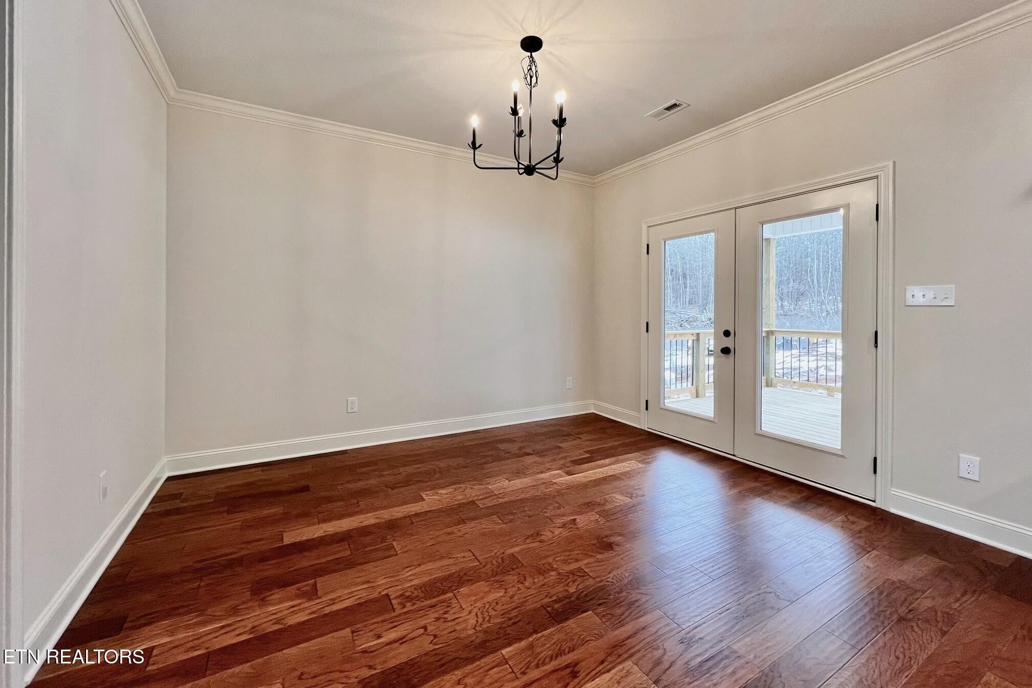 1228 Madison Oaks Road Knoxville, TN 37924 - Photo 11 of 33 wooden floor in an empty room with a window
