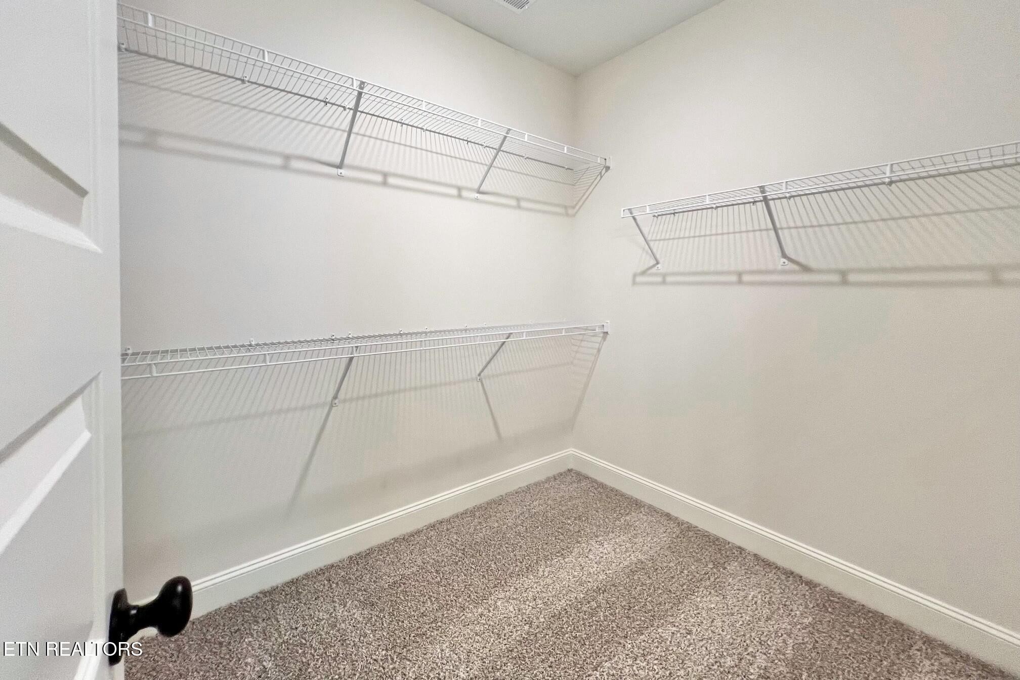 1228 Madison Oaks Road Knoxville, TN 37924 - Photo 17 of 33 a view of a room with racks on the wall