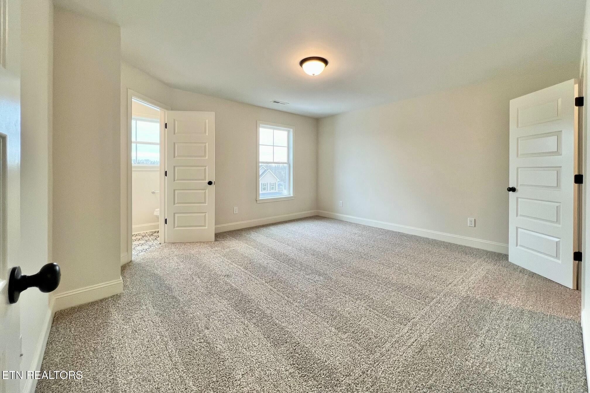 1228 Madison Oaks Road Knoxville, TN 37924 - Photo 21 of 33 a view of an empty room with a window