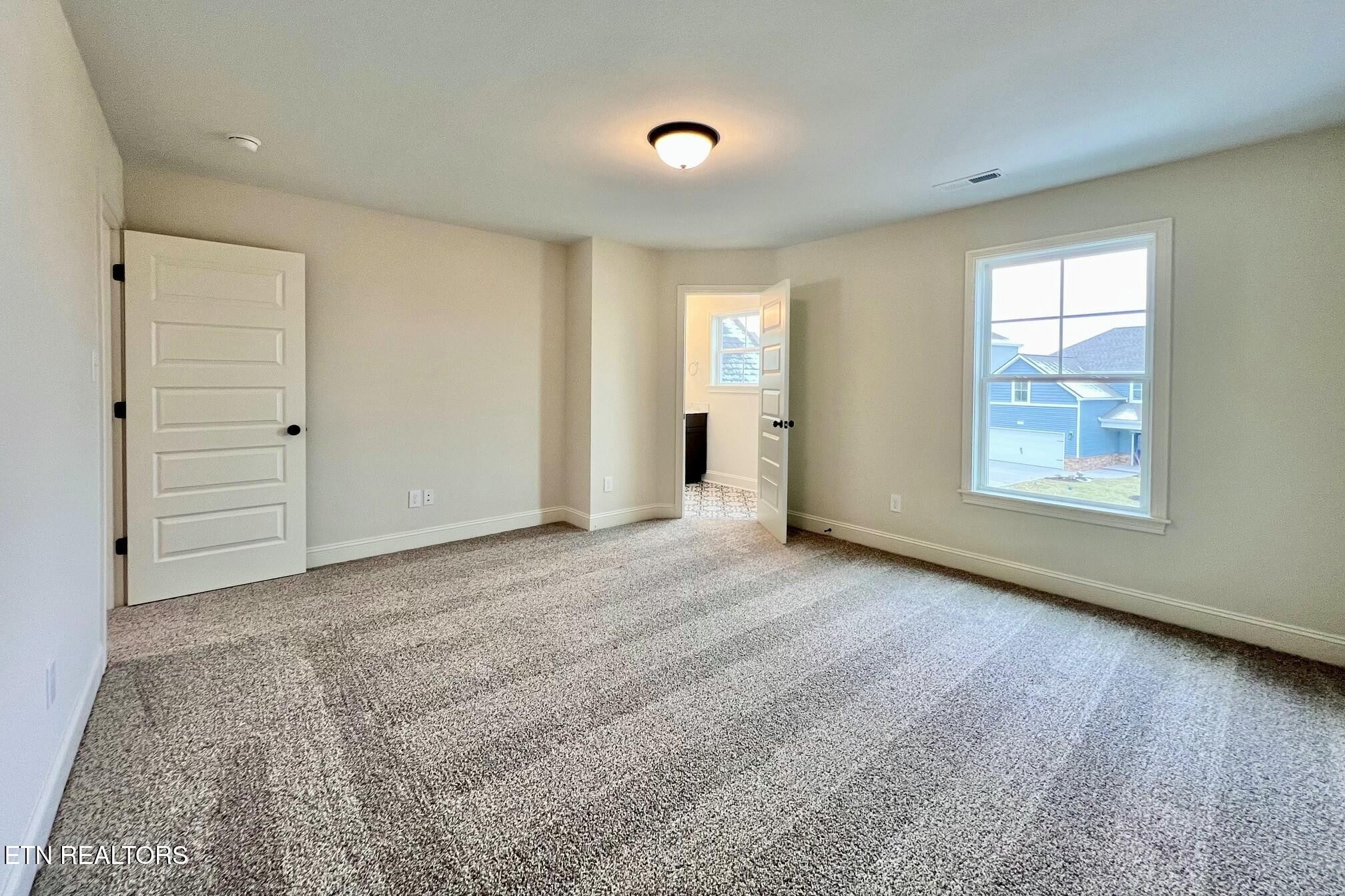 1228 Madison Oaks Road Knoxville, TN 37924 - Photo 22 of 33 a view of an empty room with a window