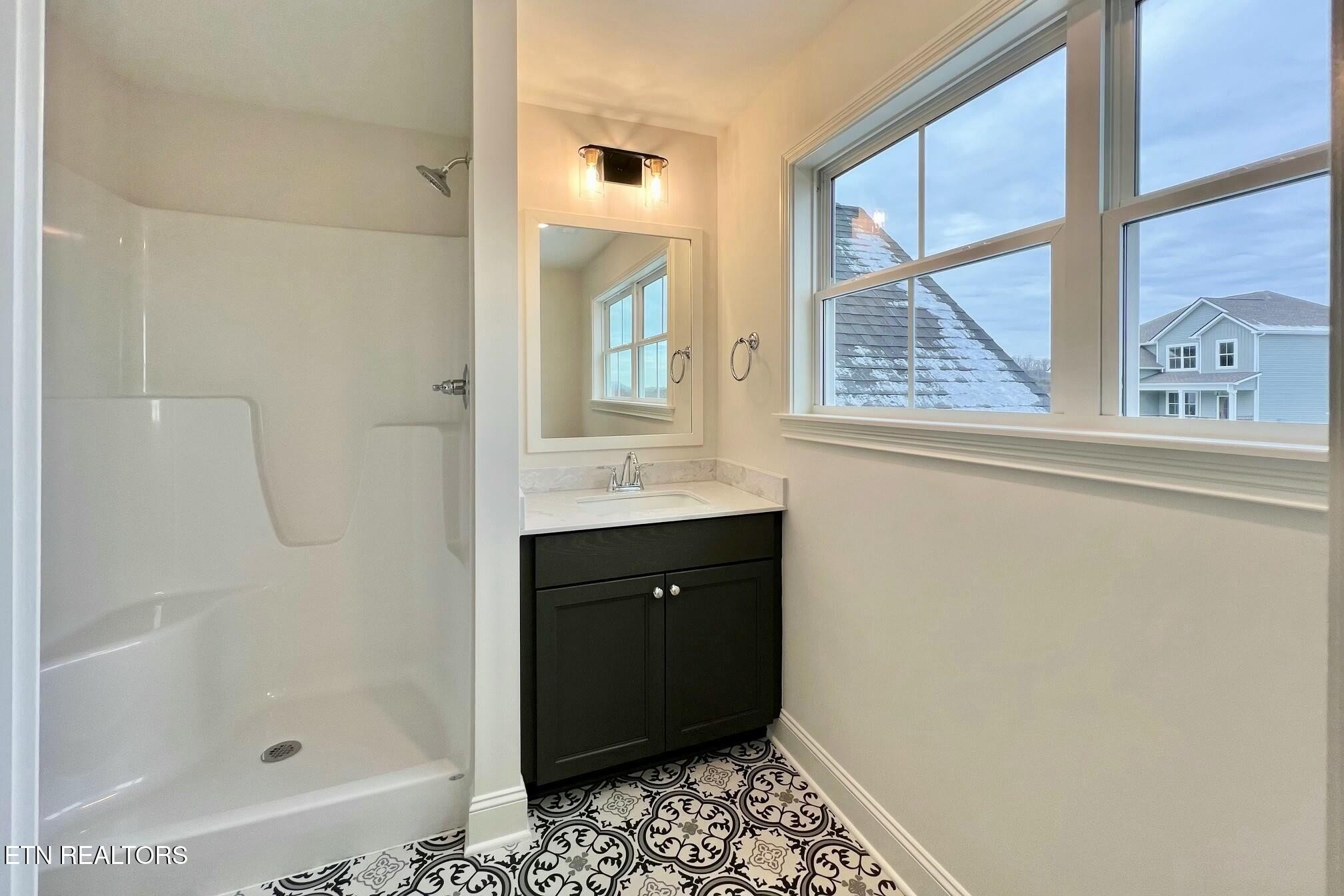 1228 Madison Oaks Road Knoxville, TN 37924 - Photo 23 of 33 a bathroom with a sink a toilet and shower
