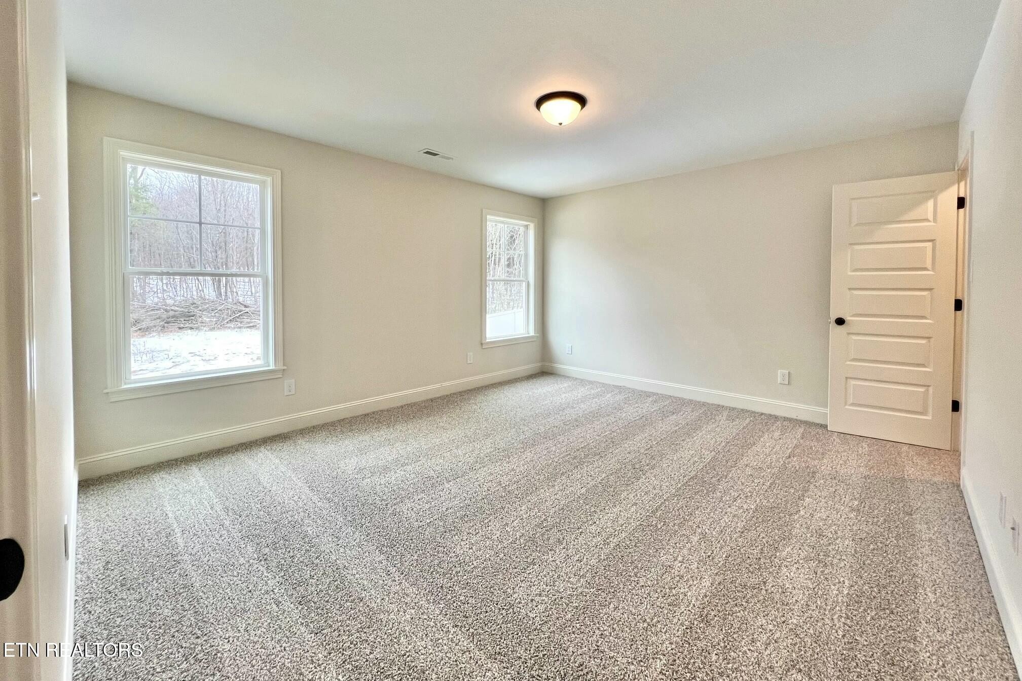 1228 Madison Oaks Road Knoxville, TN 37924 - Photo 25 of 33 an empty room with windows and closet