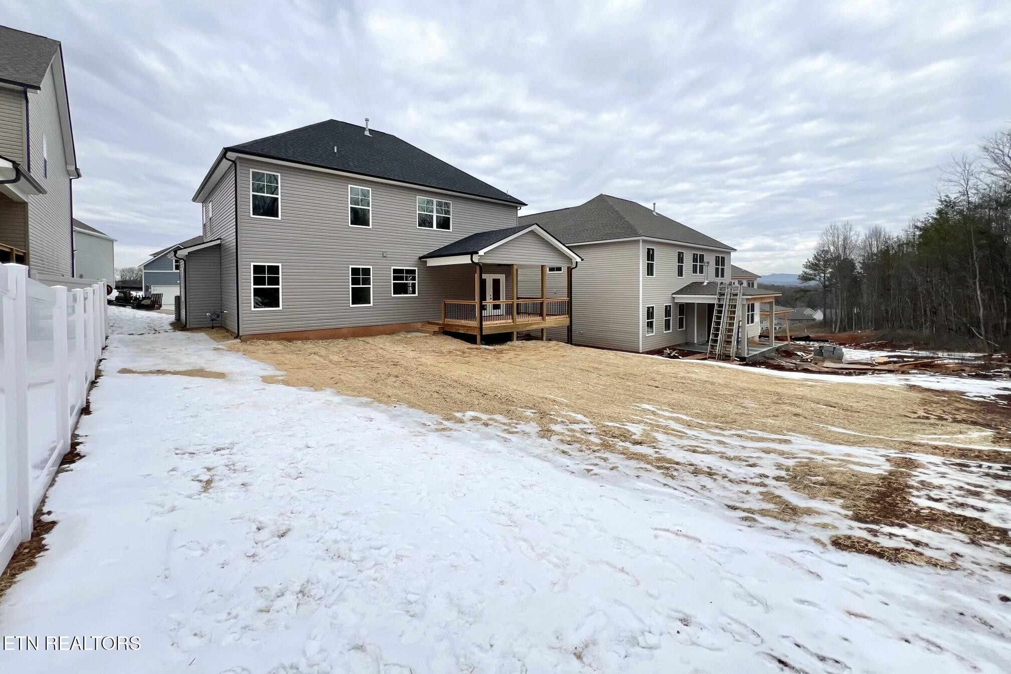 1228 Madison Oaks Road Knoxville, TN 37924 - Photo 32 of 33 a view of a house with a yard