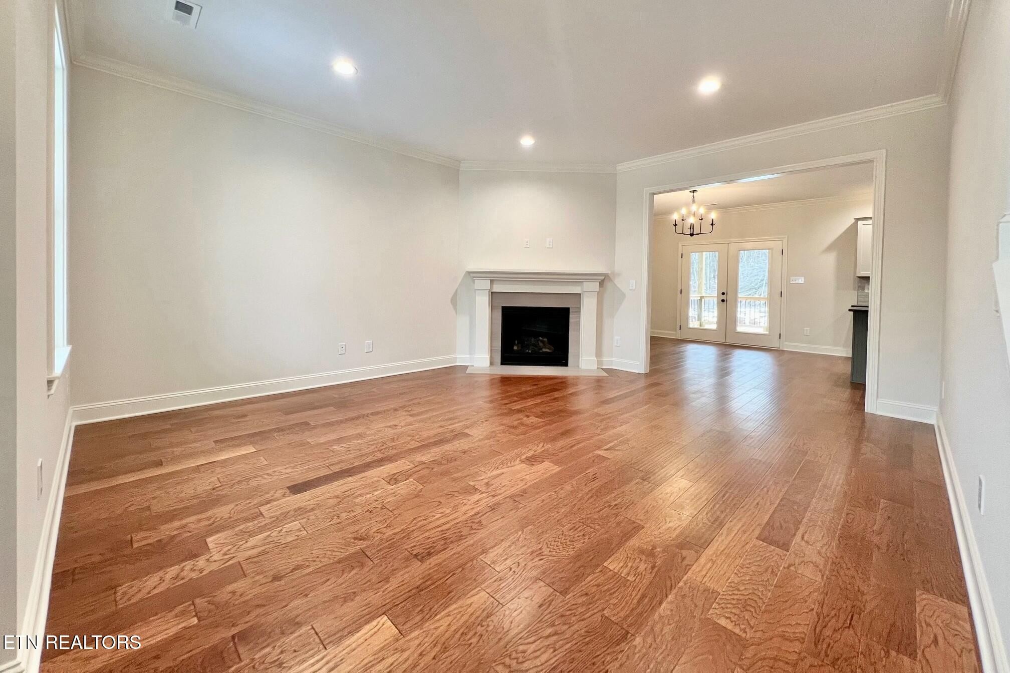 1228 Madison Oaks Road Knoxville, TN 37924 - Photo 5 of 33 a view of empty room with wooden floor