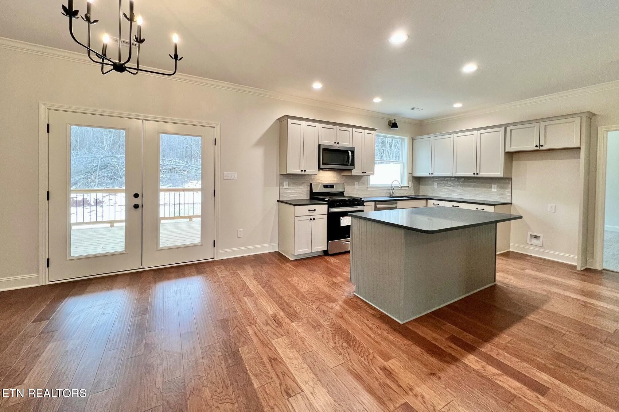 1228 Madison Oaks Road Knoxville, TN 37924 - Photo 6 of 33 a kitchen with a sink a counter top space stainless steel appliances and cabinets