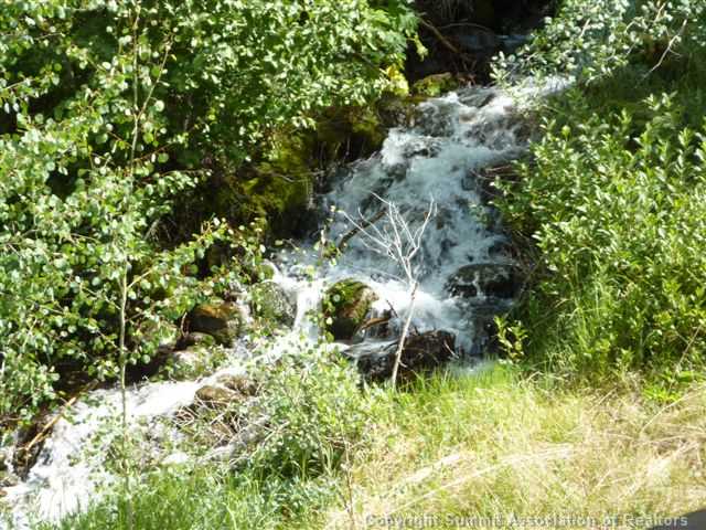 1536 Blue Ridge Road Silverthorne, CO 80498 - Photo 2 of 25 Other. Picture of the stream next to the home and small waterfall.