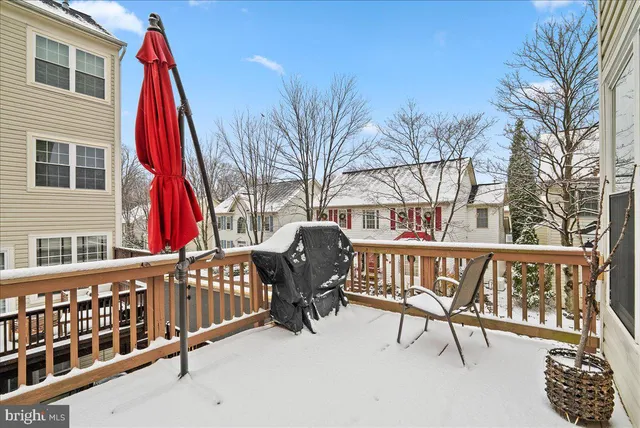 a wooden bench sitting in front of a building