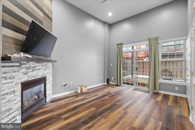a view of livingroom with hardwood floor and fireplace