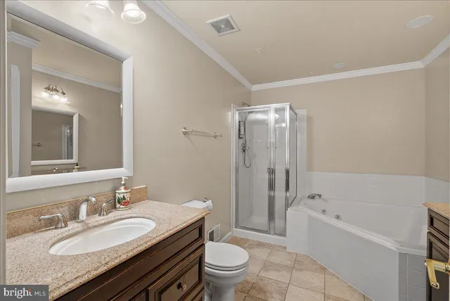 a bathroom with a sink mirror and a shower