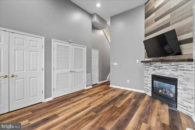 a view of an empty room with a fireplace