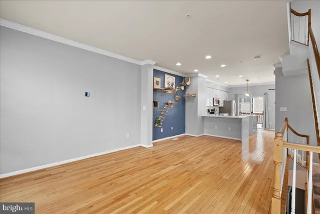 a view of a kitchen with a sink and a refrigerator