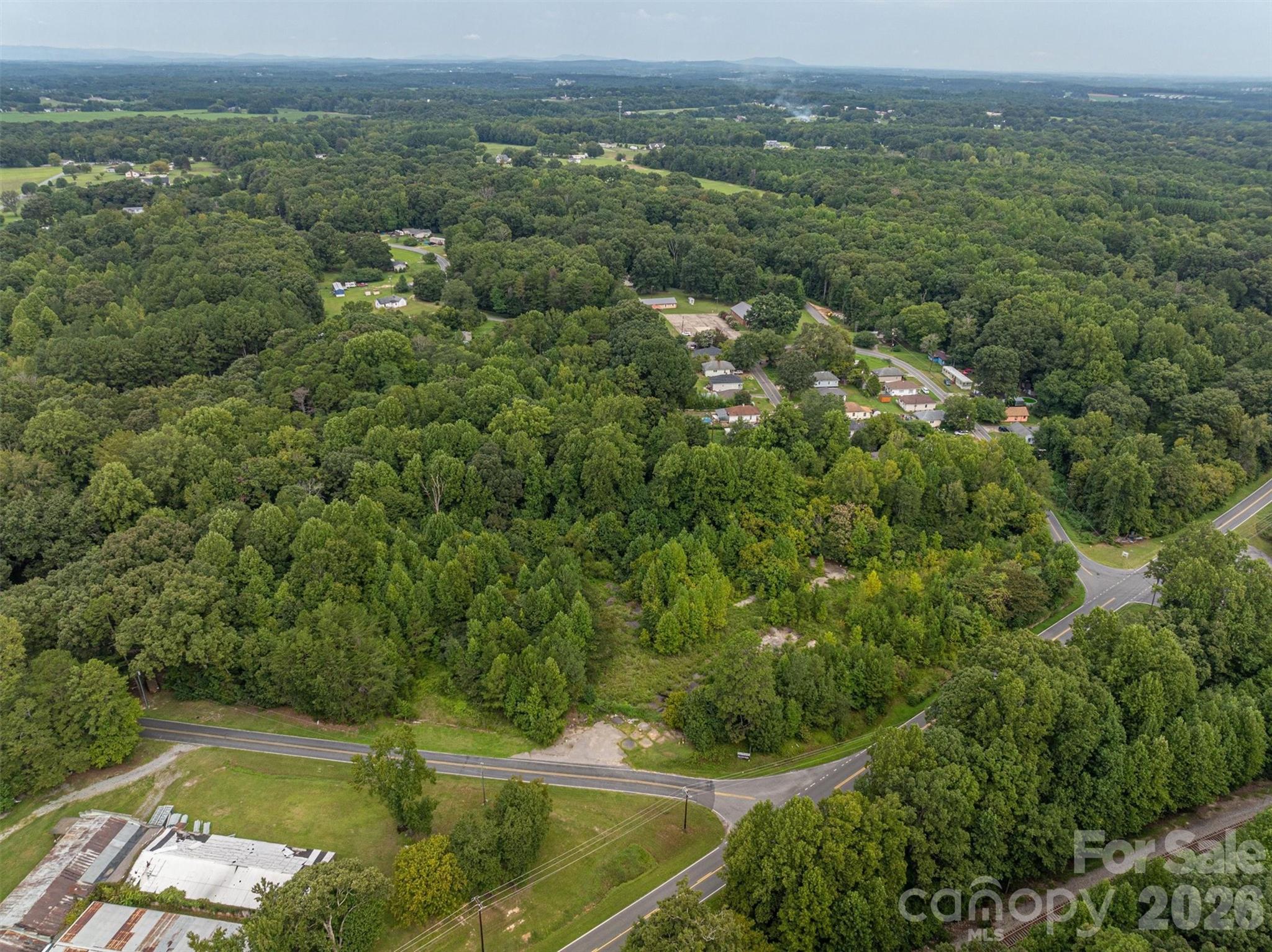 1156 Lyn Well Road Lincolnton, NC 28092 - Photo 4 of 15 an aerial view of residential houses with outdoor space and trees