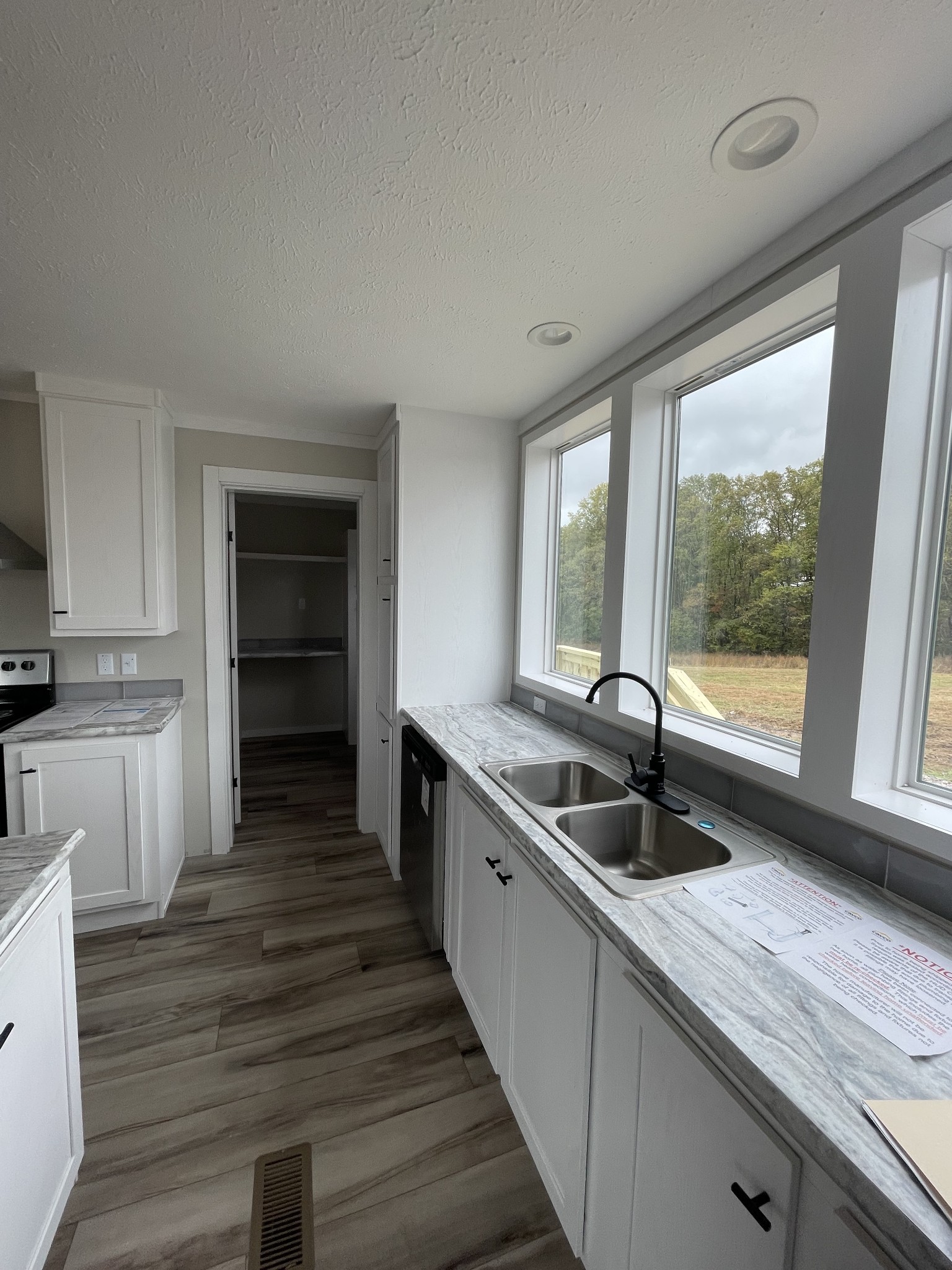881 White Springs Road Lafayette, TN 37083 - Photo 15 of 16 a kitchen with a sink and large window