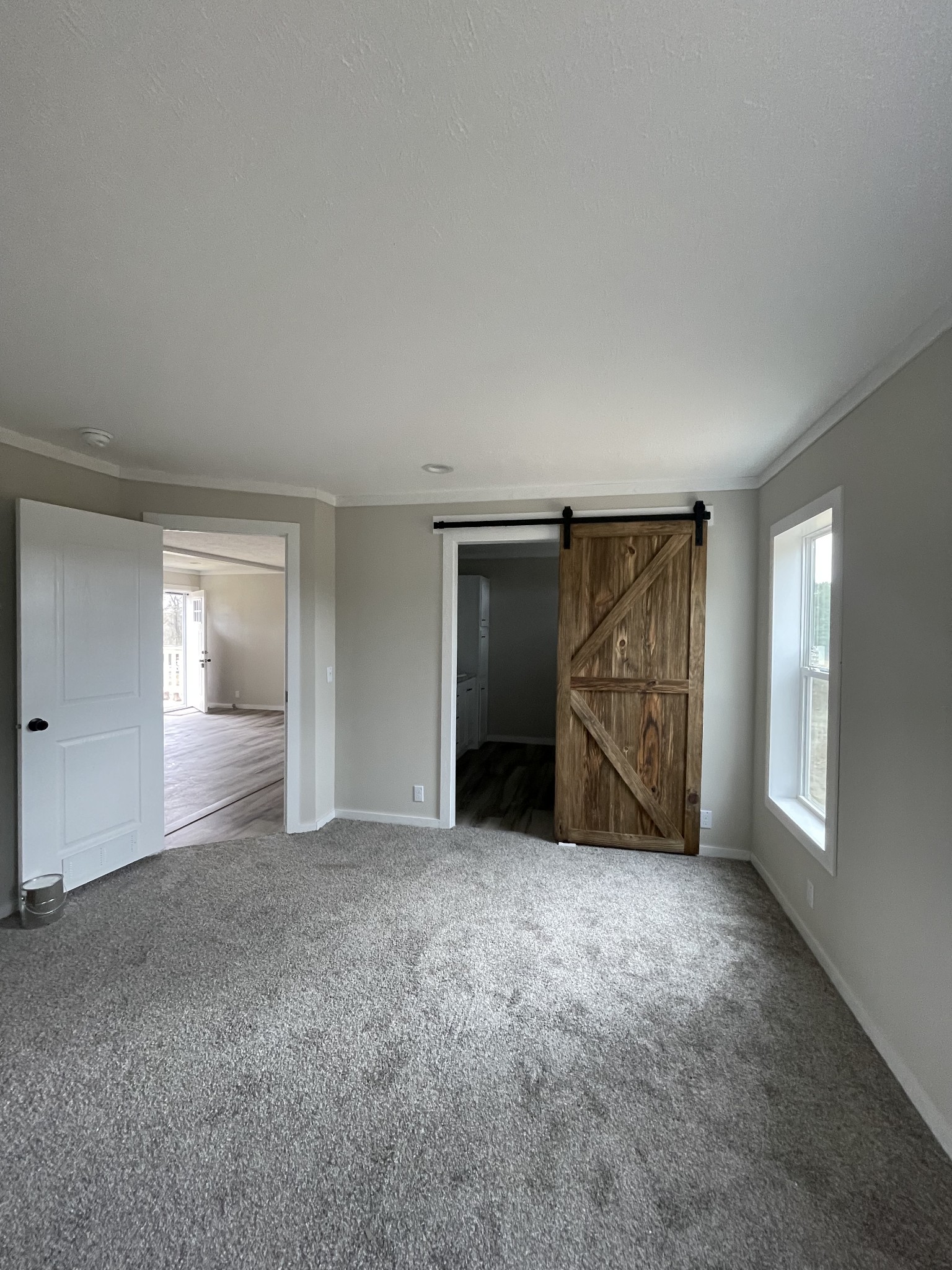 881 White Springs Road Lafayette, TN 37083 - Photo 7 of 16 a view of an empty room with closet and windows