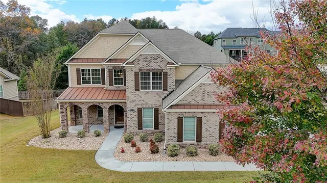 a front view of a house with a yard